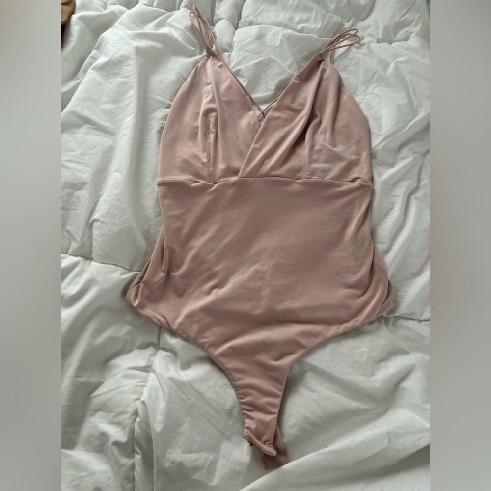 women’s large shinestar satin pinkish cream colored body suit
